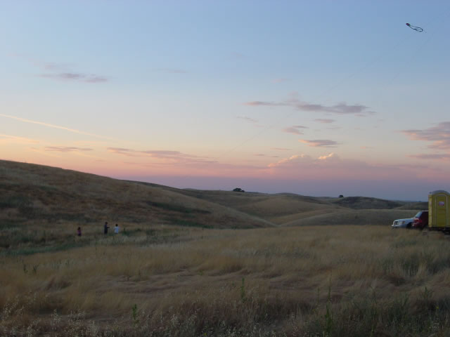 looking across the hills at the sky as sun nears setting