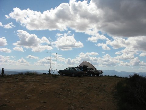 antenna mast with clouds in background
